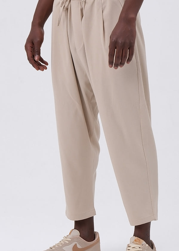 QL CLASSIK Relaxed Fit Cropped Trousers in Beige - MOOMENN