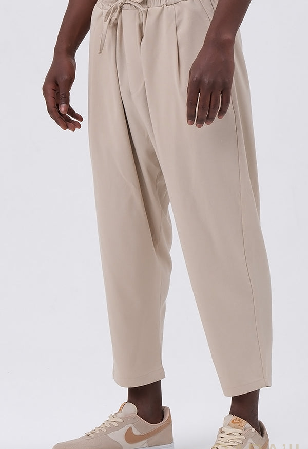 QL CLASSIK Relaxed Fit Cropped Trousers in Beige - MOOMENN
